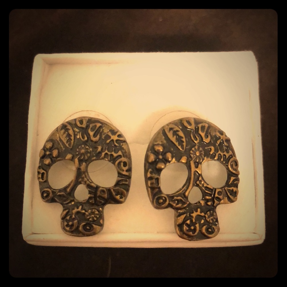 Gold plated sugar skull earrings.